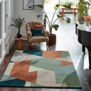 Tapete moderno geométrico em patchwork – Design abstrato em verde e terracota