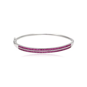May include: A silver bangle bracelet featuring two rows of small, bright pink gemstones and a central row of smaller, clear stones. The bracelet has a simple, elegant design.