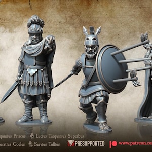 May include: Four grey miniature figurines depicting historical figures in Roman-style armor and robes. The figures are posed in various stances, including holding swords, shields, and scrolls. The text April Release and Roman and Etruscan Kings is visible.