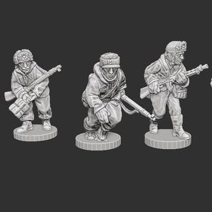 May include: A collection of five miniature soldier figurines in various action poses. Each figure is dressed in a winter uniform and holds a rifle. The figures are standing on circular bases, and the overall color is a muted gray.