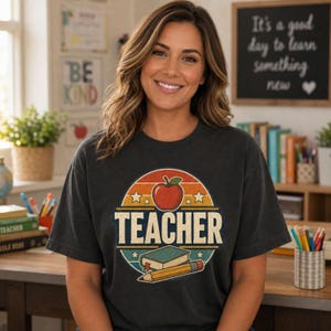 Woman wearing a Pepper teacher shirt in a cozy classroom with retro TEACHER graphic featuring apple, book, pencil and stars.