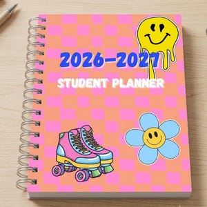 May include: A spiral-bound student planner with a pink and orange chequered cover. The text 2026-2027 STUDENT PLANNER is printed in blue and white. Graphics include a yellow melting smiley face, a blue flower with a smiley face, and pink roller skates.