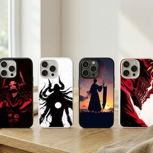May include: Four phone cases with unique designs. One case features a red and black illustration of a monster, another a black and white silhouette, a third a silhouette against a sunset, and the last a red and white illustration.