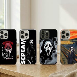 May include: Four black phone cases with horror-themed designs. One case features a red telephone and a ghost face, another has the word "SCREAM" and a ghost face, and two others have ghost face artwork.