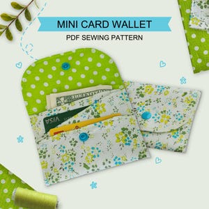 May include: A mini card wallet PDF sewing pattern featuring two fabric wallets with blue snap closures. One wallet is open, showing a green and white polka dot interior and a floral exterior, holding paper currency and a credit card.