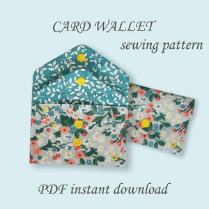 May include: A card wallet sewing pattern with a floral design and yellow button closures. The wallet is open, revealing the interior with a teal leaf pattern. The text "CARD WALLET sewing pattern" and "PDF instant download" are visible.