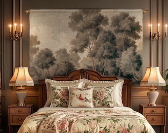 May include: A wooden bed frame with a cream-colored quilt featuring pink floral patterns and fringe trim. The bed includes matching floral pillows, two wooden nightstands with lamps, and a large wall tapestry depicting a forest scene.