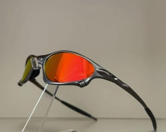 Occhiali da sole Oakley Penny & Juliet X-Metal – Montatura grigia con lenti color rubino, occhiali sportivi unisex per attività all'aperto.