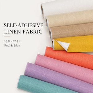 May include: A collection of self-adhesive linen fabric rolls in various colors including white, beige, tan, yellow, orange, pink, purple, and teal. The text reads SELF-ADHESIVE LINEN FABRIC and 13.8 x 47.2 in Peel & Stick. The rolls have a textured finish.