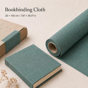 May include: A roll of teal bookbinding cloth measuring 20 x 100 cm or 7.87 x 39.37 inches, accompanied by a book bound in the same teal fabric. The text Bookbinding Cloth 20 x 100 cm / 7.87 x 39.37 in is visible at the top of the image.