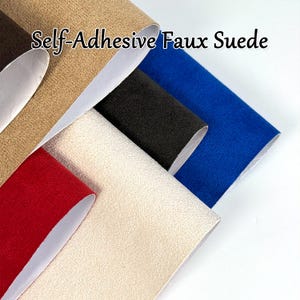 May include: A selection of self-adhesive faux suede fabric in various colors, including tan, black, red, cream, and blue. The fabric is rolled, revealing a white backing. The text "Self-Adhesive Faux Suede" is displayed at the top.