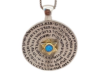 May include: A silver pendant necklace with a round charm featuring a Star of David with a blue opal in the center. The charm is surrounded by Hebrew text.