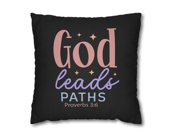 May include: A square black throw pillow featuring the text God leads PATHS Proverbs 3:6 in pink, purple, and light blue lettering. The design includes small orange four-pointed star accents scattered between the words on the front surface.