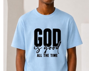 May include: A light blue short-sleeved t-shirt featuring the black printed text GOD is good ALL THE TIME on the chest. The shirt has a crew neckline and a standard fit, with the word GOD in a bold sans-serif font and the remaining text in script.