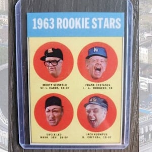 May include: A vintage 1963 Rookie Stars baseball card featuring four baseball players in circular frames. The card measures 2.5 inches by 3.5 inches.