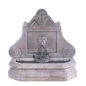 May include: A grey stone wall fountain featuring a lion's head water spout. The fountain has a basin at the bottom and ornate scrollwork and a shell-like design at the top. Water flows into a small, round basin.