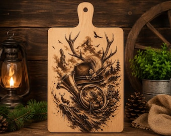 May include: A rectangular light-colored wooden cutting board with a handle at the top. The surface features a detailed dark brown laser-engraved illustration of a hunting scene, including a hat, a hunting horn, antlers, and a deer in a forest.