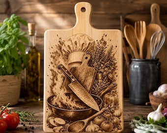 May include: A rectangular wooden cutting board with a handle and a hole for hanging. The surface features a detailed laser-engraved illustration of a chef hat, a large kitchen knife, a frying pan with flames, a wooden spoon, and fresh vegetables.