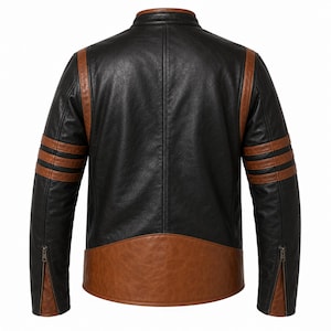 Puede incluir: Chaqueta de cuero negra y marr&oacute;n con cuello alzado. La chaqueta presenta rayas marrones en las mangas y paneles marrones en los hombros y la parte inferior de la espalda. Las mangas tienen cremalleras en los pu&ntilde;os.