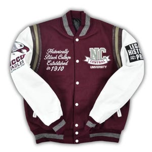 May include: A maroon and white letterman jacket with the text "NCCU EAGLES" on the left sleeve and "LEG HIST PR" on the right sleeve. The jacket has the text "Historically Black College Established in 1910" and "NC CENTRAL UNIVERSITY" on the front.
