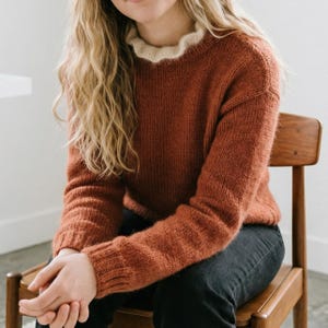 May include: A handmade wooden sign with the text "Welcome" in a playful font. The sign features a distressed white background and a dark brown border, perfect for a front door or entryway. Measures approximately 12 inches wide.