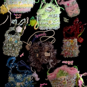 May include: A collection of handmade, fluffy crossbody bags in various colors, including green, pink, blue, and brown. Each bag features unique textures, embellishments, and attached charms. Some bags have text labels and decorative cords.