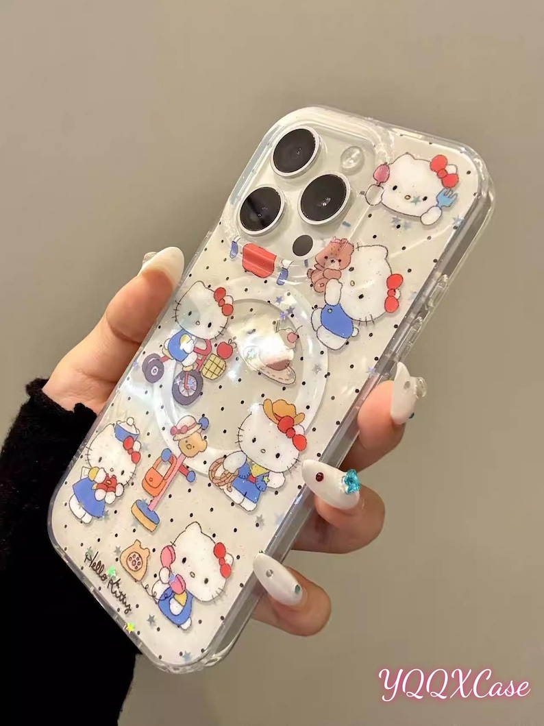 May include: Clear phone case featuring a repeating pattern of Hello Kitty characters in various poses, with red bows and blue outfits. The case has a clear border and a circular cutout for the camera.
