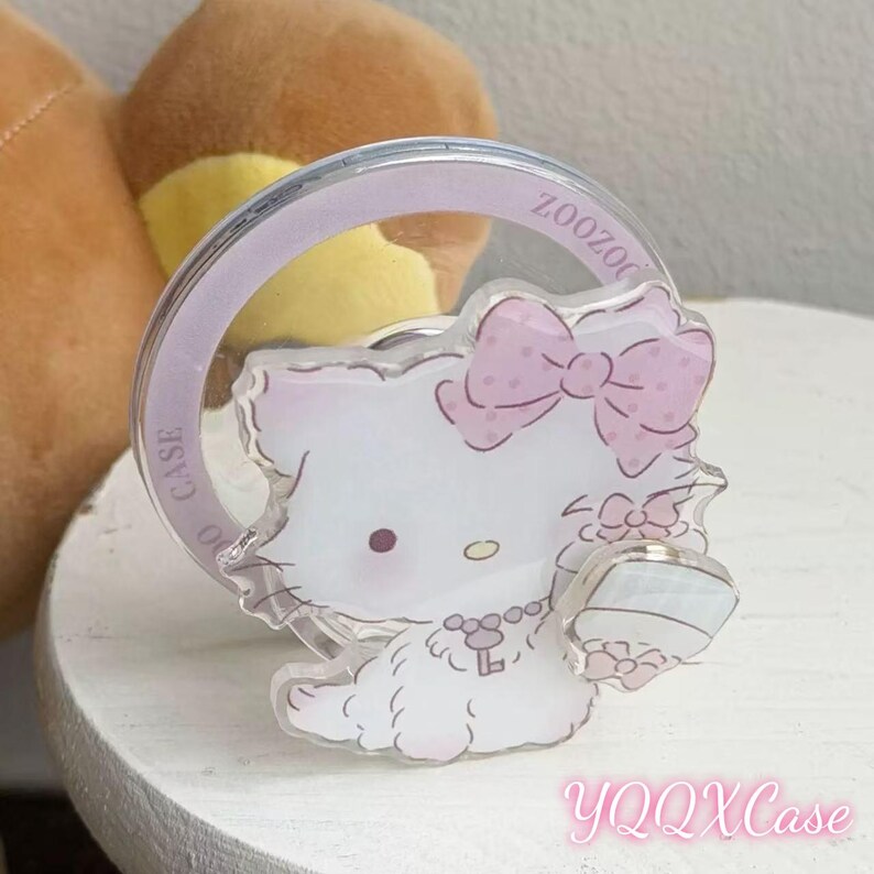 Funda transparente MagSafe con diseño de Hello Kitty en color rosa claro con estampado de varios gatitos, compatible con iPhone 15 / 16 / 17 Pro Max. MagSafe Grip Olny