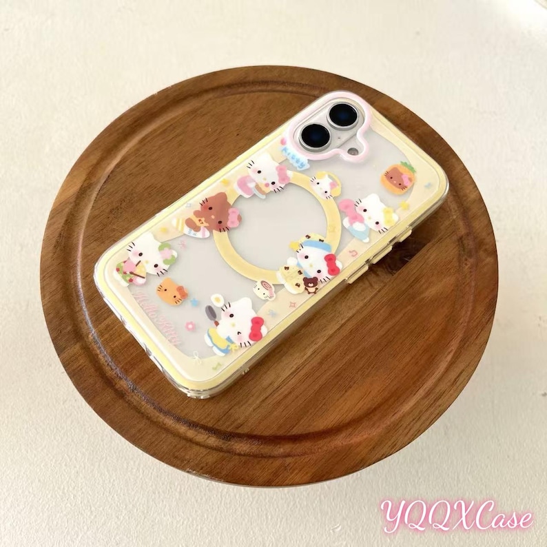 May include: A clear phone case with a yellow border and a variety of cartoon character designs. The case features a circular cutout for the camera and is decorated with colorful, three-dimensional figures. The text "YQQXCase" is visible in the bottom right corner.