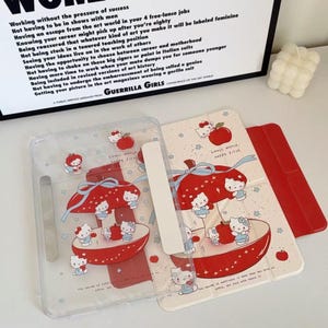 Magnetic Detachable iPad Case for iPad 2026 / Air 8/7/6,Dual-Sided Design Featuring Hello Kitty Red Apple Art on Clear Panel Guerrilla Girls