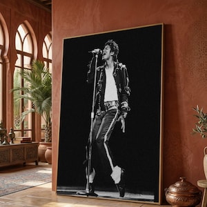 May include: A black and white vertical wall art print featuring a performer singing into a microphone on a stand. The figure wears a dark jacket with metallic accents, a white shirt, dark trousers with a side stripe, and white socks with black shoes.