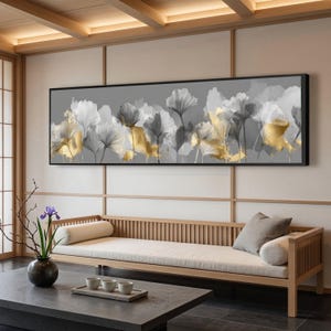 Elegante tela decorativa com folhas de ginkgo, em tons metálicos dourados e cinza, com estampa botânica floral. Decoração moderna e natural para sala de estar.