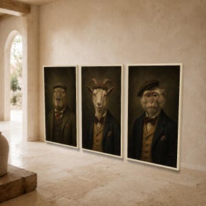 May include: A set of three framed wall art prints featuring anthropomorphic portraits of a capybara, a goat, and a monkey. Each animal is dressed in a formal suit, waistcoat, bow tie, and flat cap, rendered in muted, dark, and earthy tones.