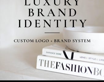 May include: A white ceramic bowl sits atop two stacked books, one titled THE FASHION BOOK and the other by Garance Dore. The text LUXURY BRAND IDENTITY, CUSTOM LOGO + BRAND SYSTEM, and STUDIO160DESIGN BRANDS WITH A PURPOSE are displayed in black.
