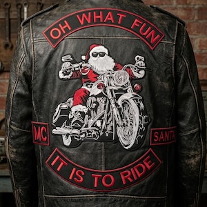 May include: Black leather motorcycle jacket featuring a Santa Claus patch riding a motorbike. The patch includes the phrases "OH WHAT FUN", "MC", "SANTA", and "IT IS TO RIDE" in red text.