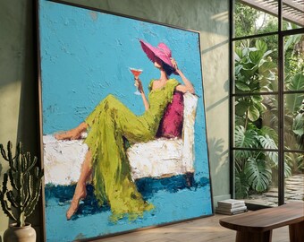 Elegant Lady in Green Dress with Pink Hat, Relaxing on Sofa Canvas, Sophisticated Female Figure Wall Art, Modern Home Decor Canvas