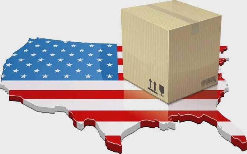 May include: A tan cardboard shipping box with black handling symbols and a barcode, positioned on top of a three-dimensional map of the United States featuring the red, white, and blue stars and stripes flag pattern across its entire surface area.