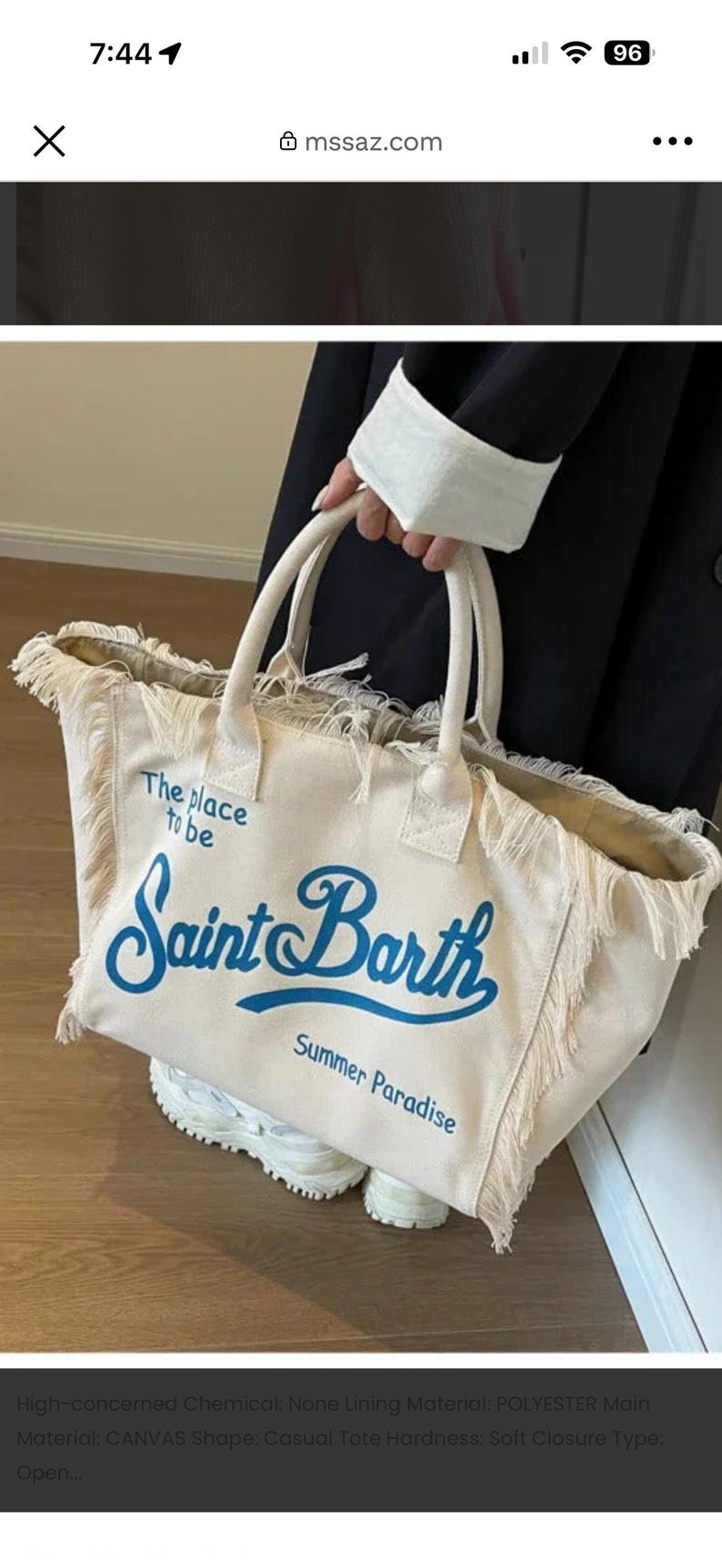 May include: A cream-colored canvas tote bag with frayed edges and two top handles. The bag features blue printed text that reads "The place to be", "Saint Barth", and "Summer Paradise" on the front. The bag has an open top design.