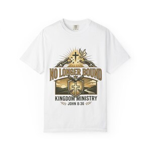 May include: White t-shirt with a graphic design. The design includes the text "NO LONGER BOUND" above a cross, dove, and shield with the words "KINGDOM MINISTRY" and "JOHN 8:36".