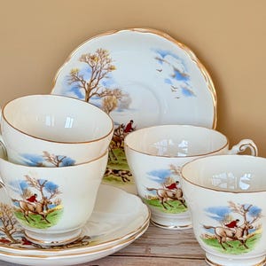 Juego de 4 tazas y platillos de porcelana fina inglesa estilo Regencia con escena de caza (8 piezas)