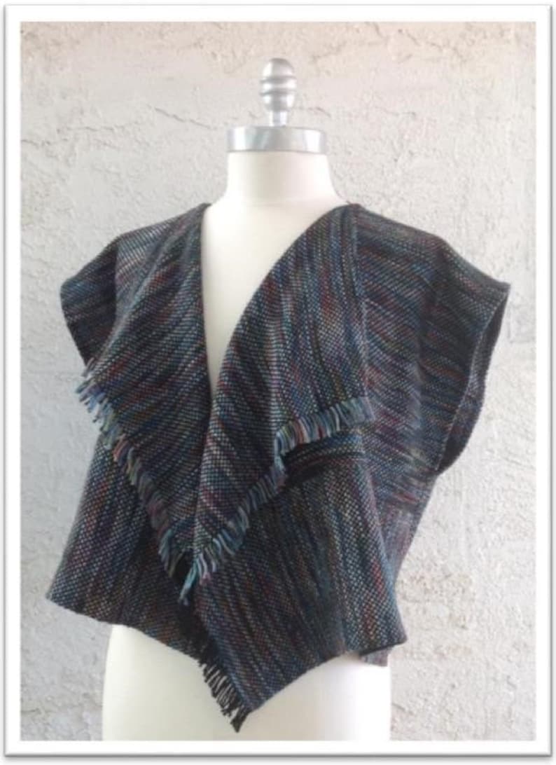 May include: A sleeveless, black and multi-coloured woven vest with a fringed collar and a V-neck.