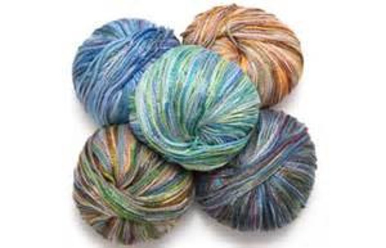 May include: Five balls of yarn in various shades of blue, green, brown, and white. The yarn is multi-coloured and has a striped pattern.