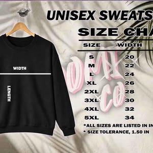 May include: Black unisex sweatshirt hanging on a wooden hanger. The image includes a size chart with measurements in inches for width and length, ranging from size S to 5XL.