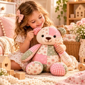May include: A plush teddy bear constructed from various fabric patches featuring pink, green, and cream floral patterns alongside pink and white gingham checks. The bear has round black eyes, a stitched brown nose, and a soft, stuffed body.