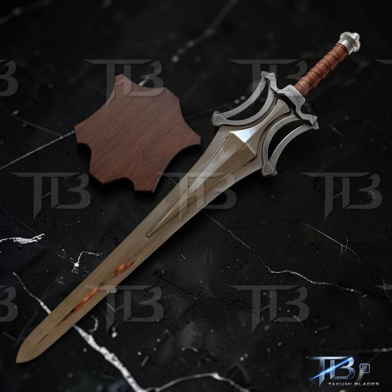 May include: A silver sword with a brown leather-wrapped handle and a wooden display stand. The blade has a polished finish, and the hilt features an ornate design. The sword is displayed on a black marble surface.