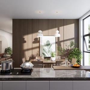 Può includere: Interni di cucina moderna con una pentola e una padella in acciaio inossidabile su un piano cottura nero. Un tavolo da pranzo con sedie è posto di fronte a una parete in legno con una stampa botanica incorniciata. La stanza ha grandi finestre e lampade a sospensione.