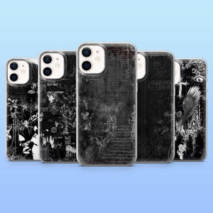 May include: A collection of five clear phone cases with black and white gothic-themed designs. The cases feature various graphics, including angel wings, text, and abstract patterns. The cases are displayed against a light blue background.