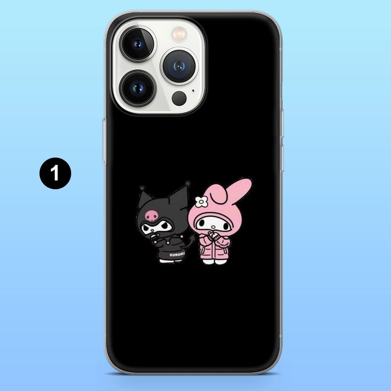 May include: Black phone case featuring a cartoon illustration of two characters. One character is black with a pig nose and the other is pink with a flower on its head. The word "KUROMI" is printed on the bottom.