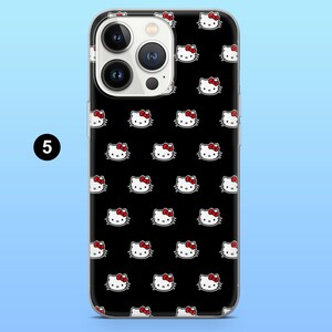 May include: Black phone case with a repeating pattern of white cartoon cat faces with red bows. The phone case has a clear border and a camera cutout. The number "5" is in a white circle in the upper left corner.