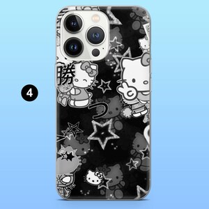 May include: Black and white phone case featuring a repeating pattern of Hello Kitty characters and stars. The case has a clear border and includes Japanese text. The design is a playful and cute accessory.